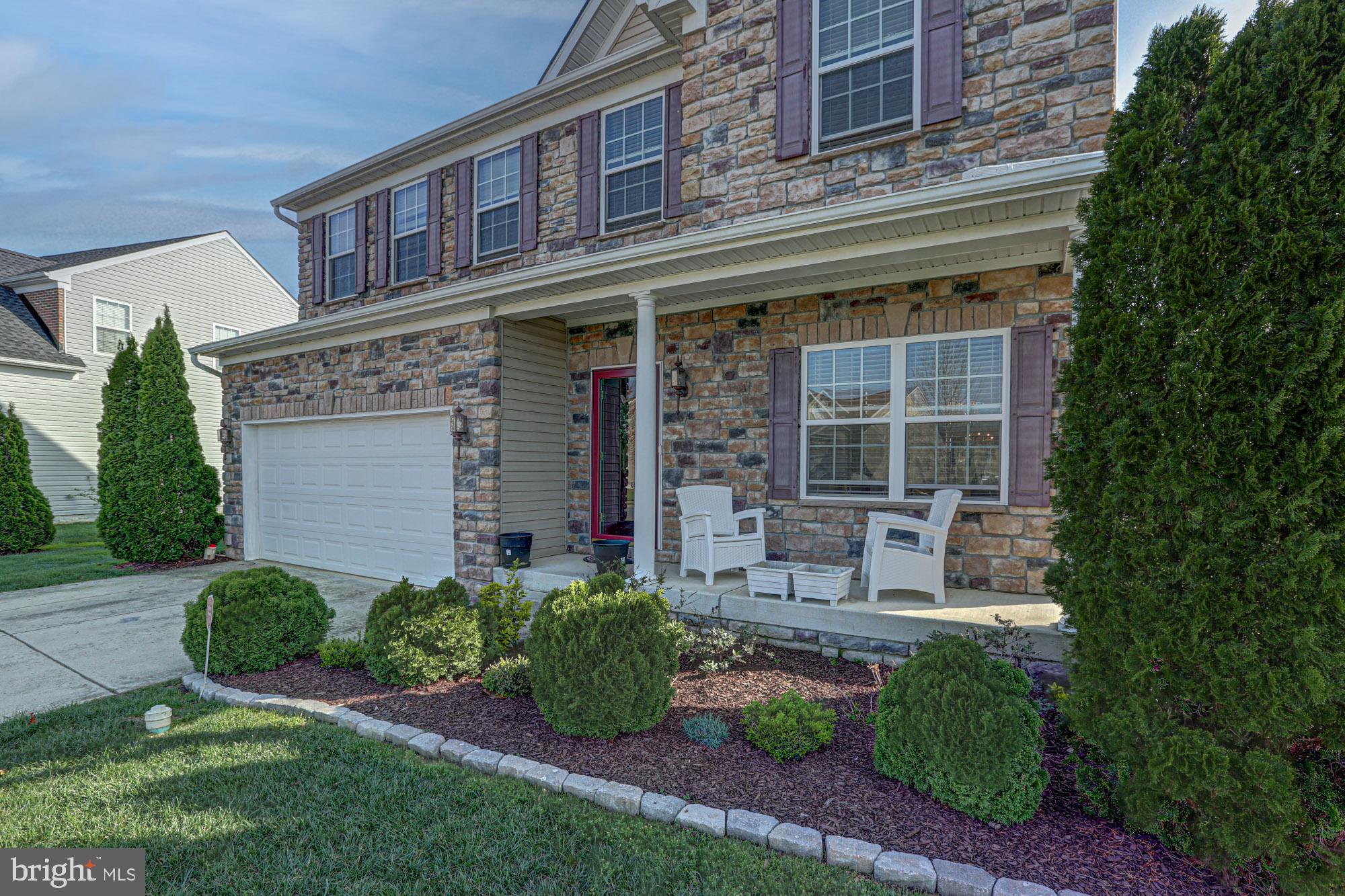 43 Autumn Terrace Magnolia, DE 19962 - Photo 19 of 86 a front view of a house with outdoor seating and a garden