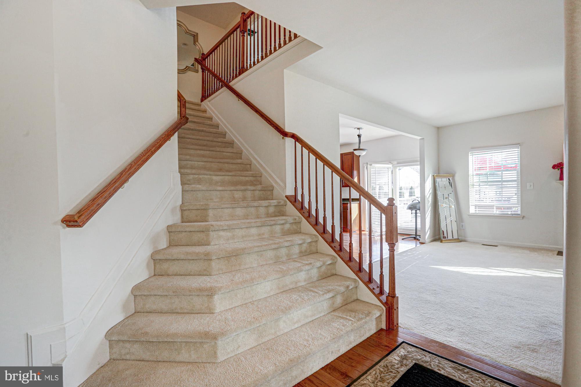 43 Autumn Terrace Magnolia, DE 19962 - Photo 41 of 86 a view of staircase with lots of frames on wall and windows