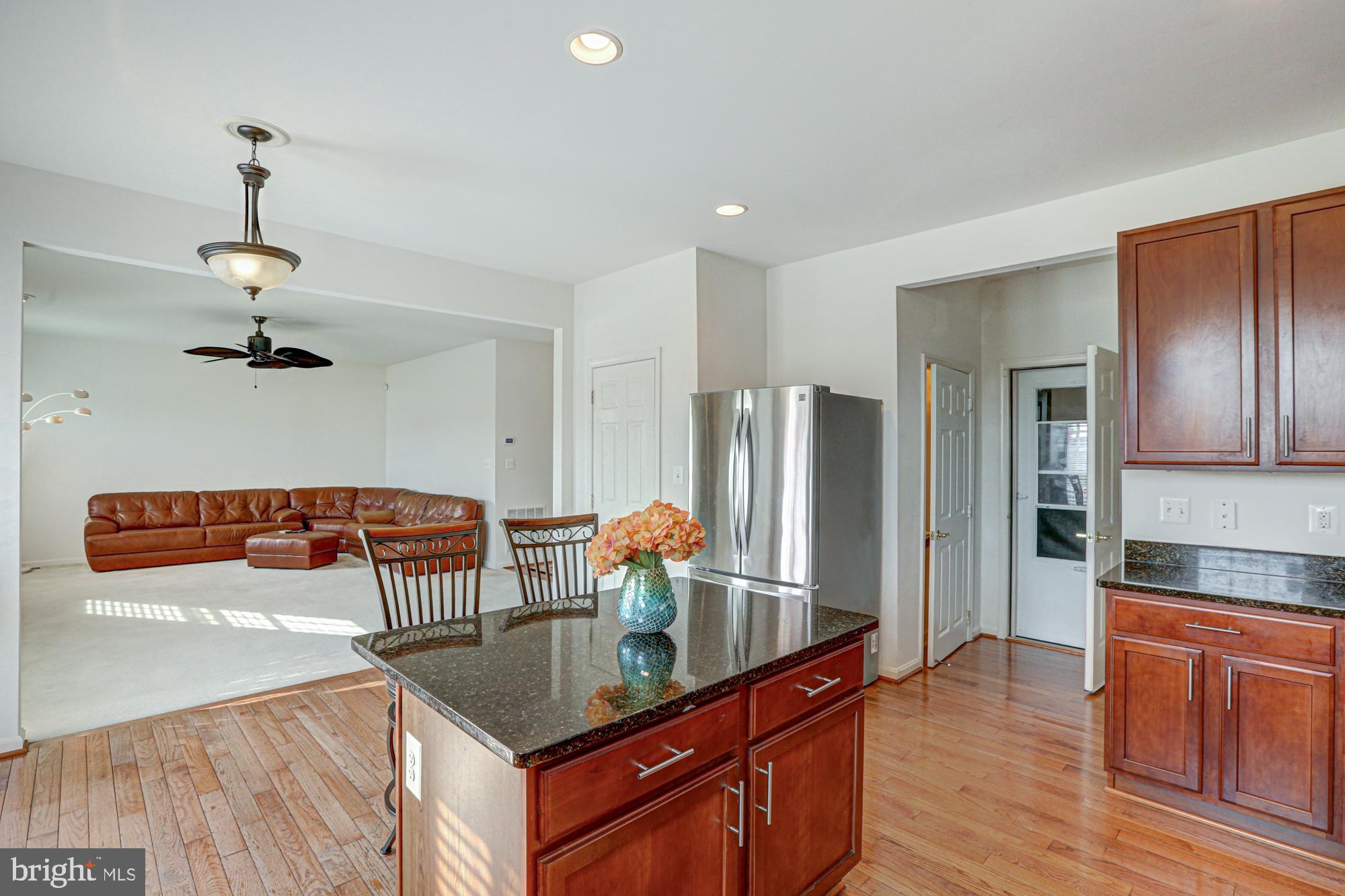 43 Autumn Terrace Magnolia, DE 19962 - Photo 48 of 86 a kitchen with stainless steel appliances granite countertop a sink a refrigerator and a stove