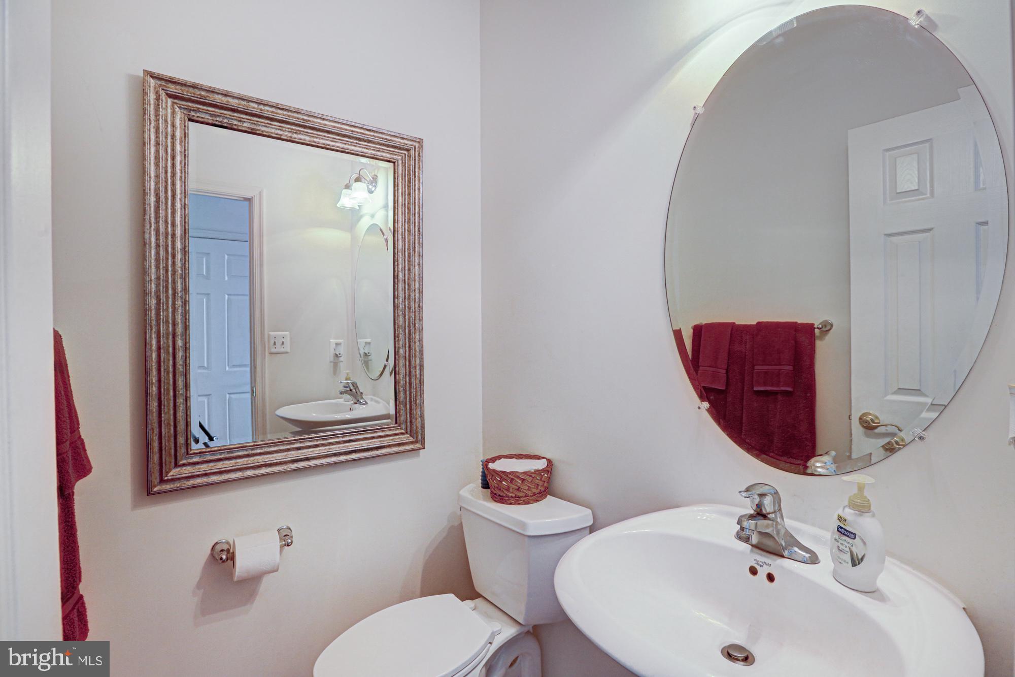 43 Autumn Terrace Magnolia, DE 19962 - Photo 54 of 86 a bathroom with a toilet sink and mirror