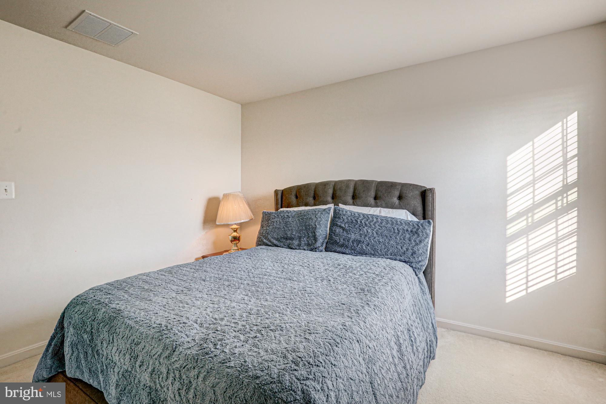 43 Autumn Terrace Magnolia, DE 19962 - Photo 59 of 86 a bedroom with a bed and window