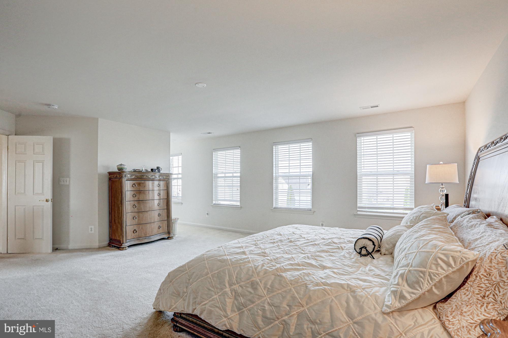 43 Autumn Terrace Magnolia, DE 19962 - Photo 69 of 86 a bedroom with a bed and wooden floor