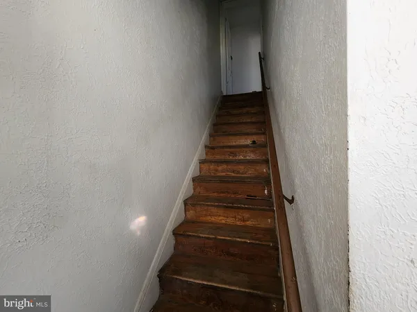 a kitchen with a sink a stove a refrigerator and cabinets