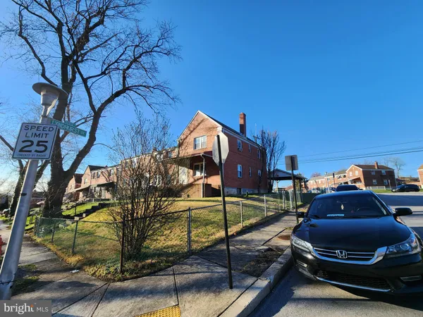 a car parked in front of a house