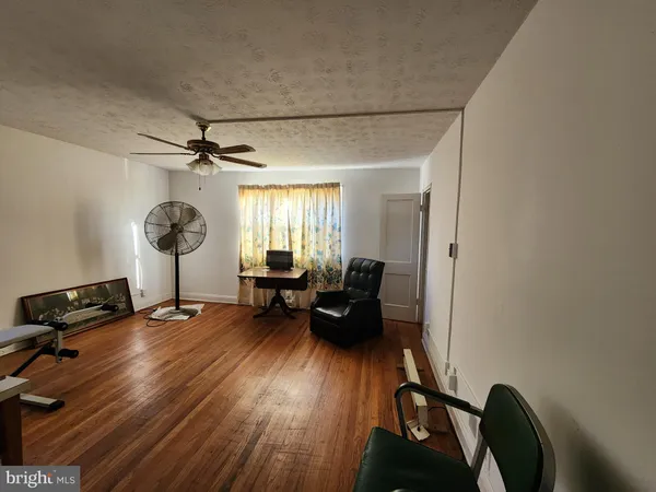 a bedroom with furniture window and a mirror