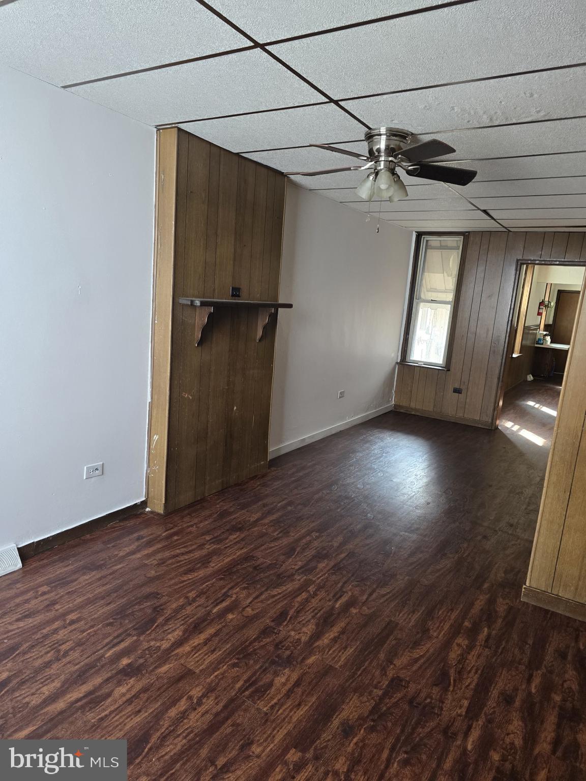 940 Mulberry Street Reading, PA 19604 - Photo 2 of 8 an empty room with wooden floor cabinet and windows