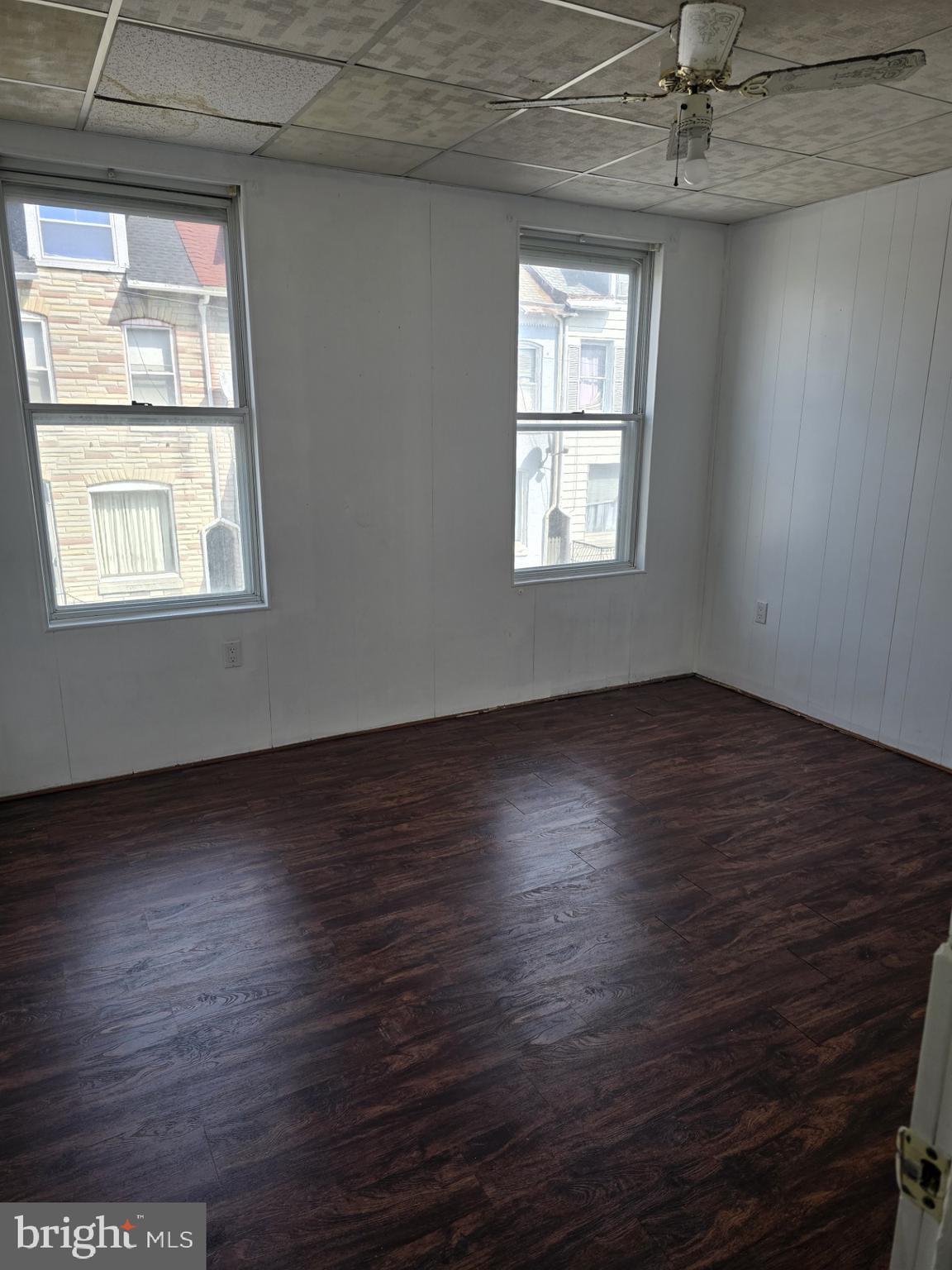 940 Mulberry Street Reading, PA 19604 - Photo 4 of 8 an empty room with wooden floor and windows