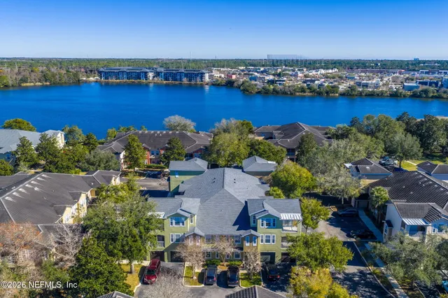 an aerial view of a houses with a lake view