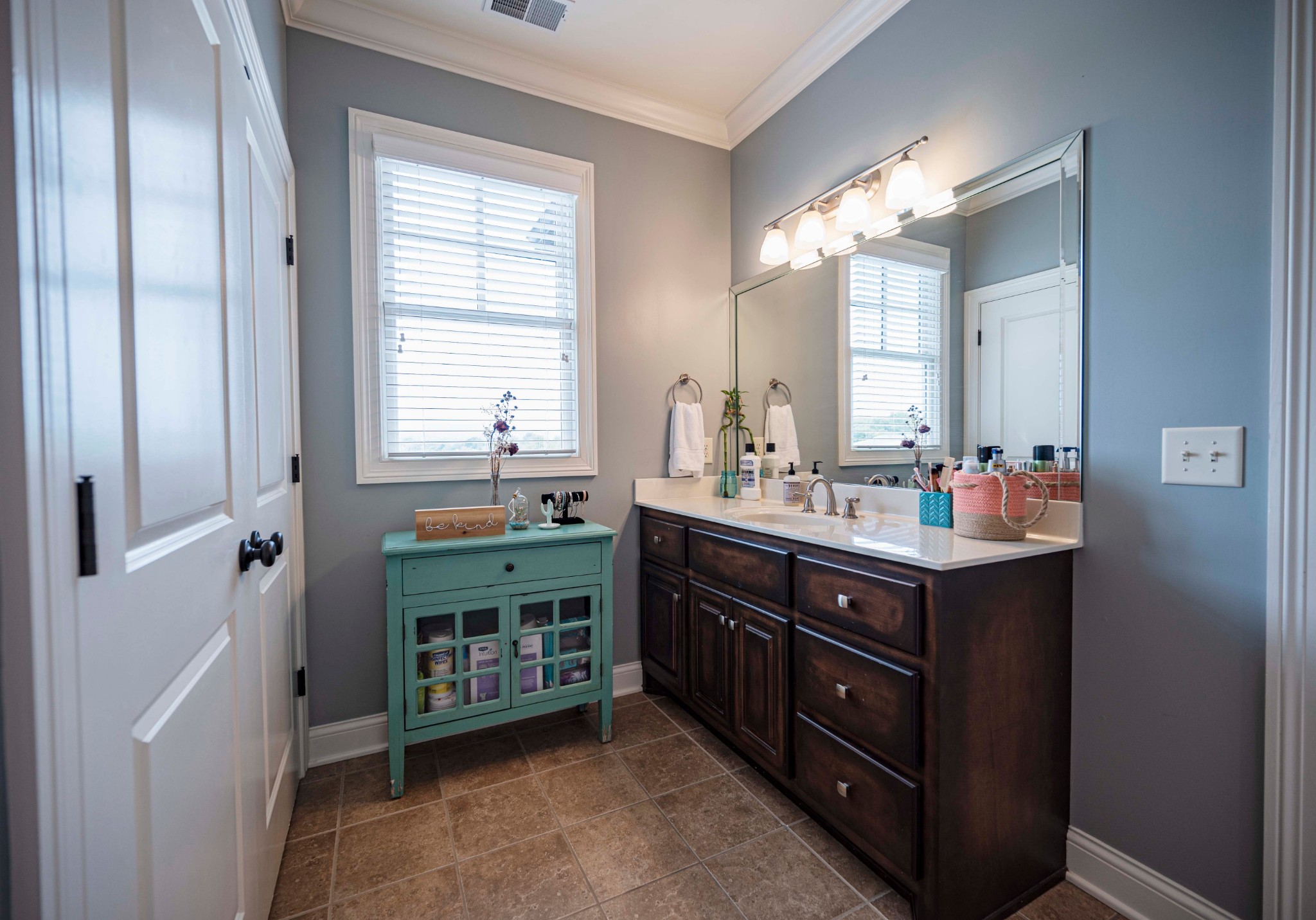 5436 South Commerce Road Watertown, TN 37184 - Photo 18 of 27 a bathroom with a double vanity sink and a mirror