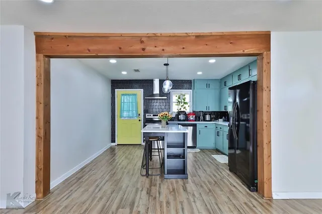 a kitchen with a table and chairs