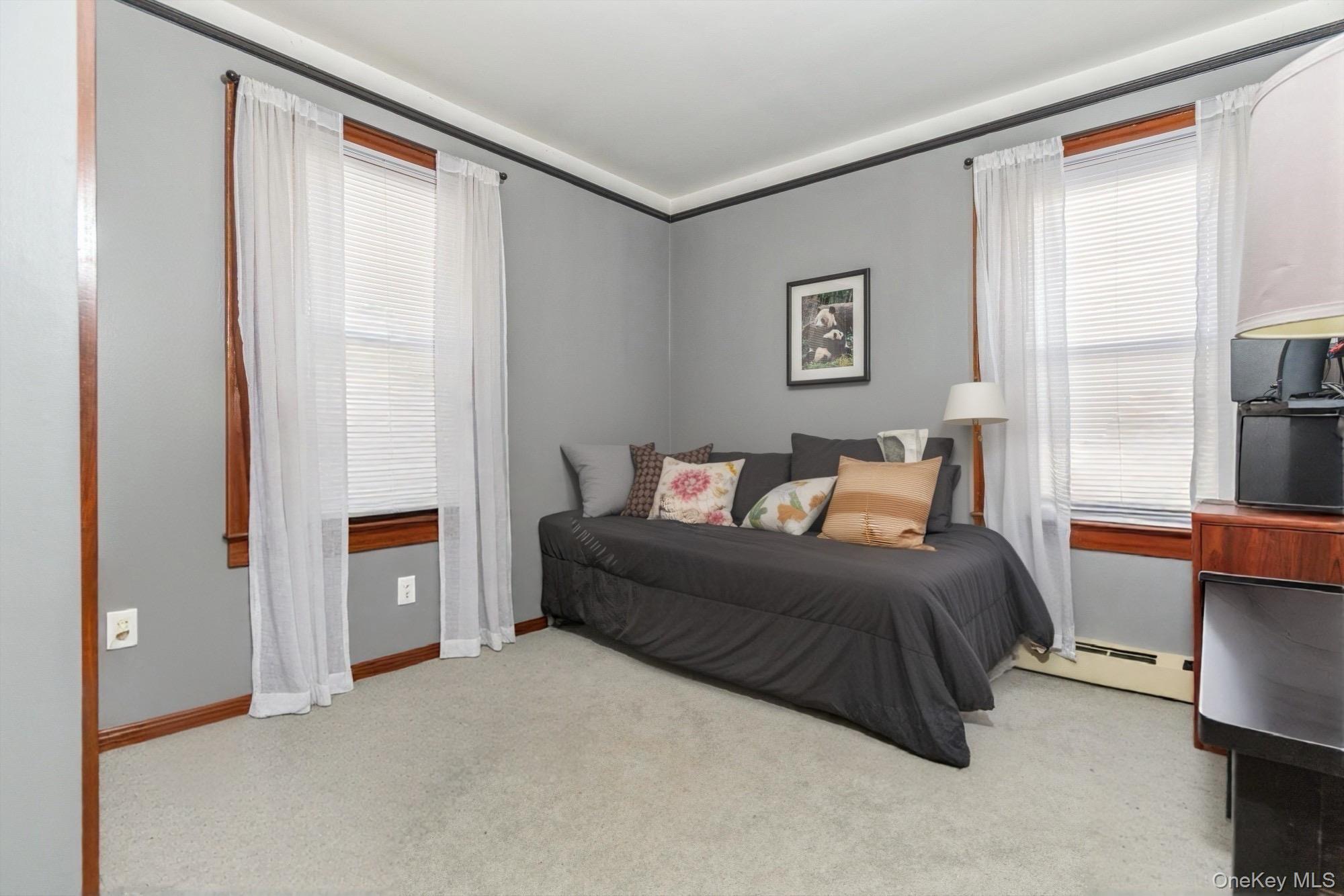 59 Prairie Avenue Suffern, NY 10901 - Photo 11 of 21 a bedroom with a bed and a couch