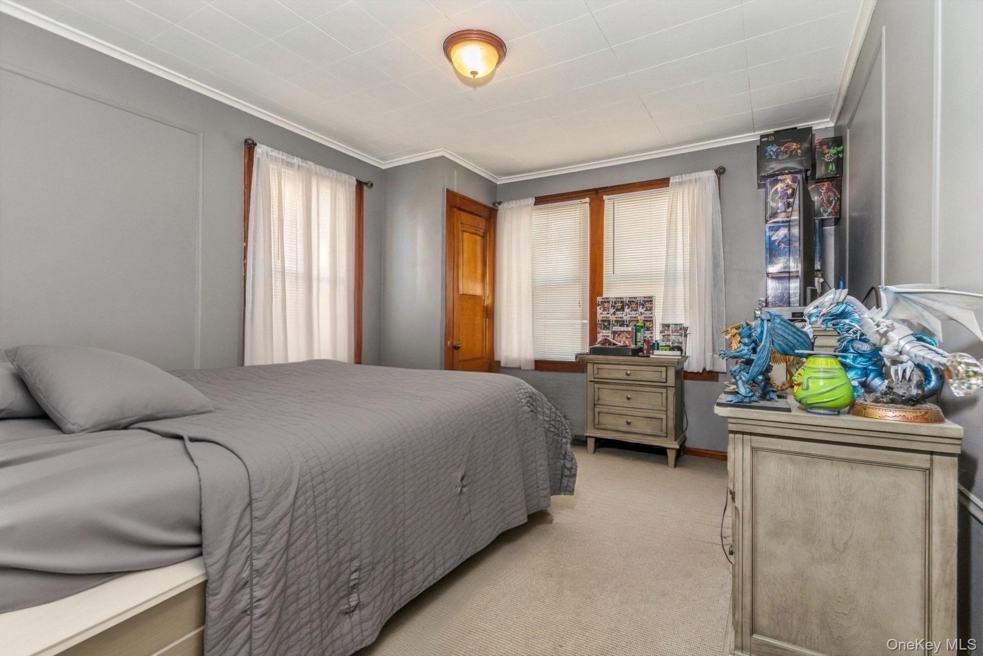 59 Prairie Avenue Suffern, NY 10901 - Photo 12 of 21 a bedroom with a bed and a couch