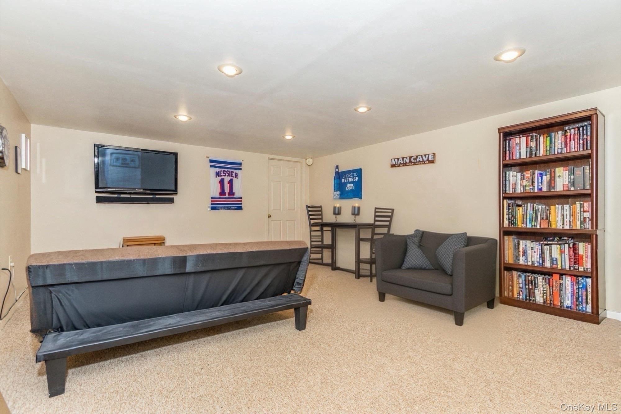 59 Prairie Avenue Suffern, NY 10901 - Photo 18 of 21 a living room with furniture and a flat screen tv
