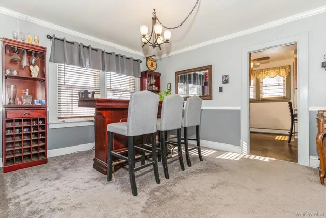 a dining room with furniture and window