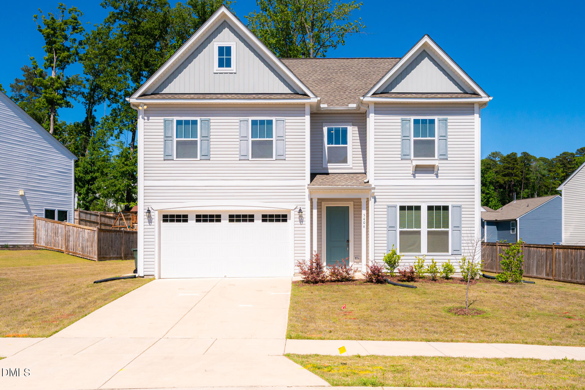 5406 Ripplebrook Drive Durham, NC 27712 - Photo 2 of 37 a front view of a house with a yard and garage