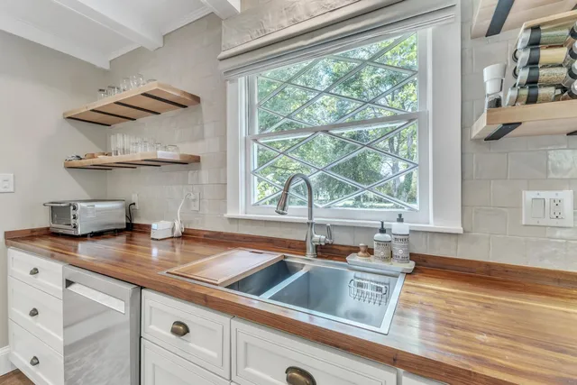 a kitchen with a sink and a window