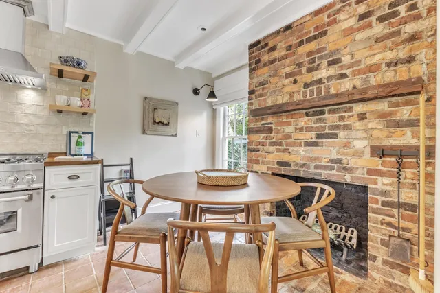 a view of a dining room with furniture and window