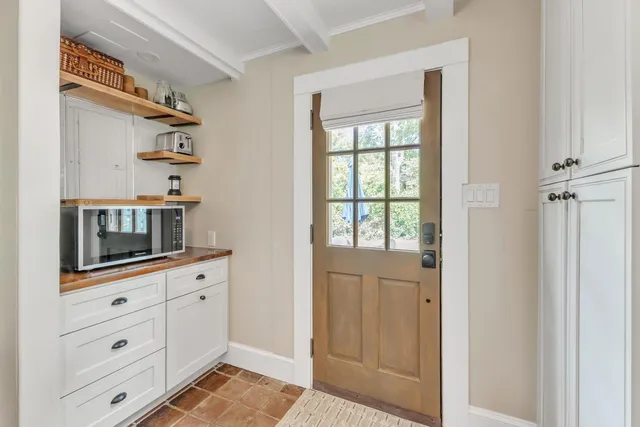 a room with cabinets and wooden floor