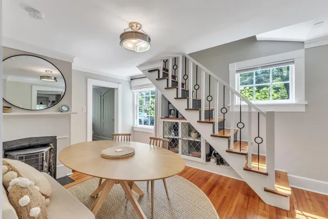 a view of a livingroom with furniture and a floor to ceiling window