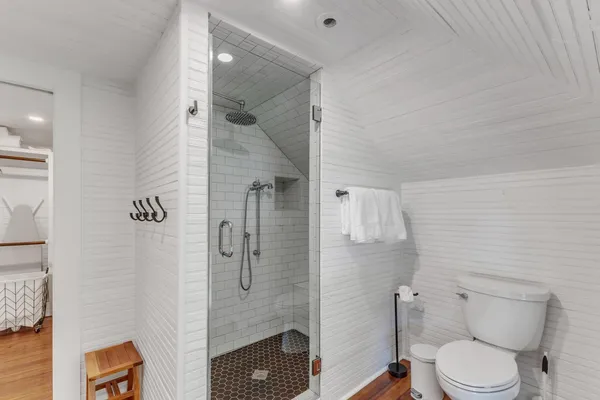 a white toilet sitting next to a bathroom sink