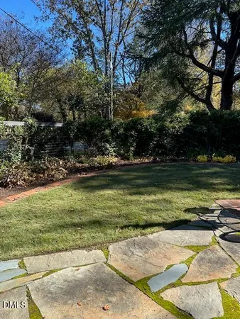 a view of a swimming pool with a yard