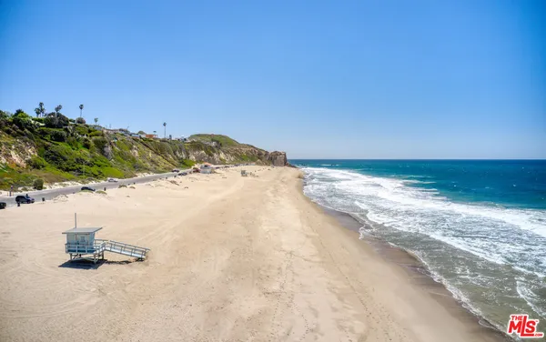 a living room with furniture and a clock