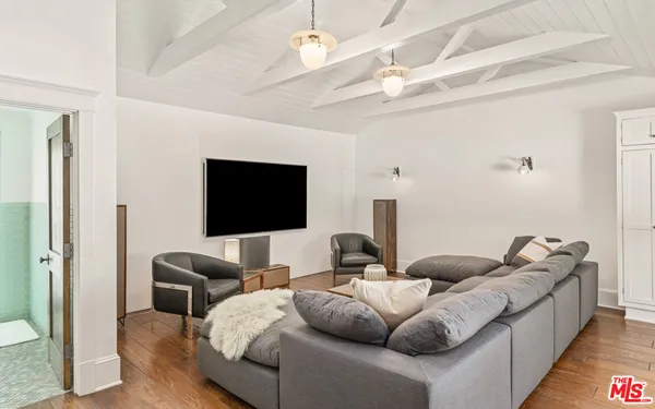 a view of a dining room with furniture wooden floor and chandelier
