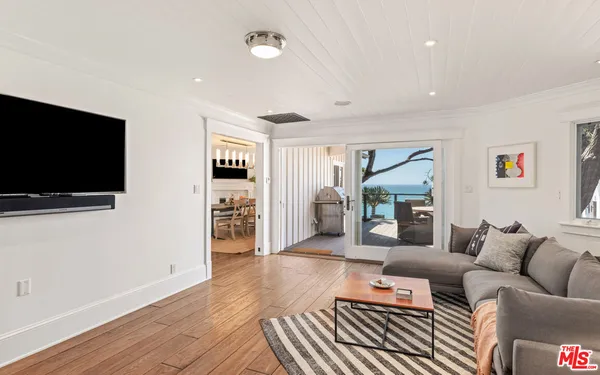 a view of a porch with wooden floor and fence