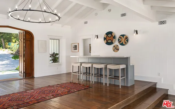 a view of a livingroom with furniture and a fireplace