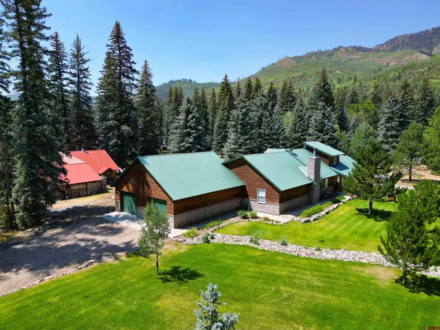 a view of a house with a big yard