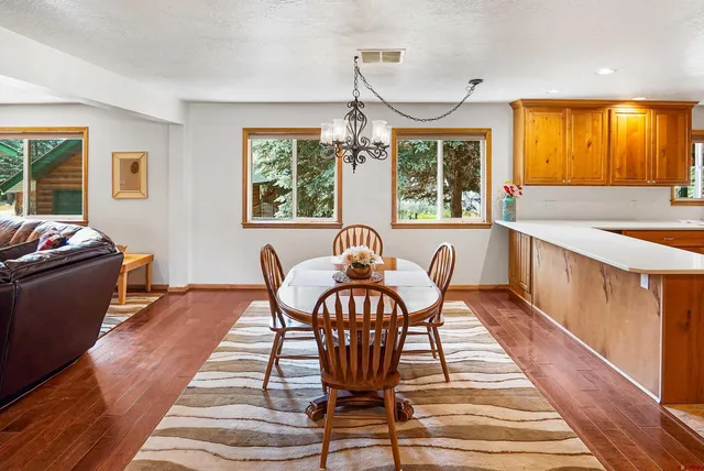 a view of a dining room with furniture