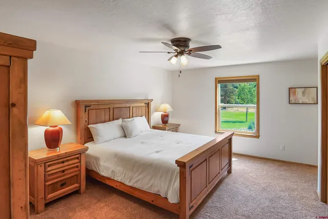 a bathroom with a double vanity sink mirror and shower