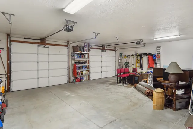 a kitchen that has a lot of cabinets in it and wooden floors