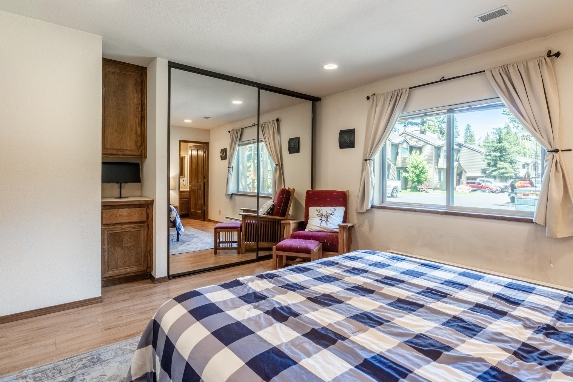 384 Joaquin Road, Unit 36 Mammoth Lakes, CA 93546 - Photo 24 of 36 Recessed lighting illuminates this room, featuring wood-finish flooring and a large window with wind
