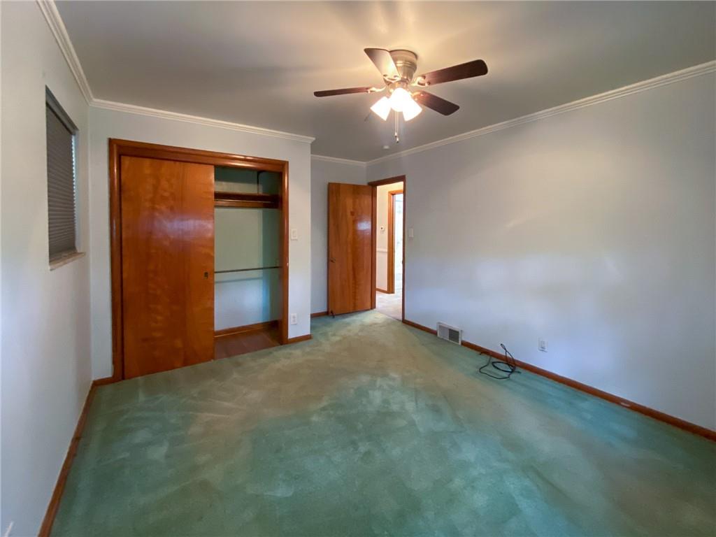 128 Clover Drive Monaca, PA 15061 - Photo 12 of 19 an empty room with chandelier fan