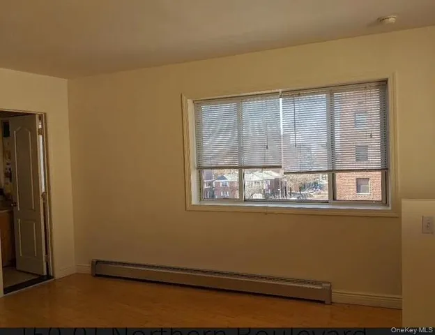 a view of a room that has a window