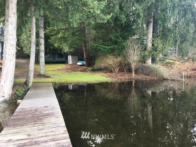 1517 Southwest Lake Roesiger Road Snohomish, WA 98290 - Photo 15 of 26 a view of swimming pool with a patio and a yard