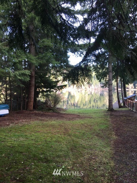 1517 Southwest Lake Roesiger Road Snohomish, WA 98290 - Photo 16 of 26 a view of a yard with large trees