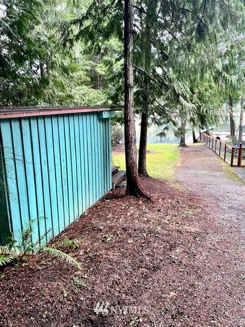 1517 Southwest Lake Roesiger Road Snohomish, WA 98290 - Photo 10 of 26 a view of a backyard with swimming pool