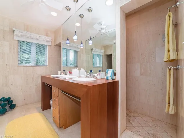 a bathroom with a double vanity sink and a mirror