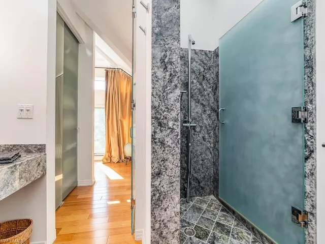 a view of a bathroom with a shower curtain