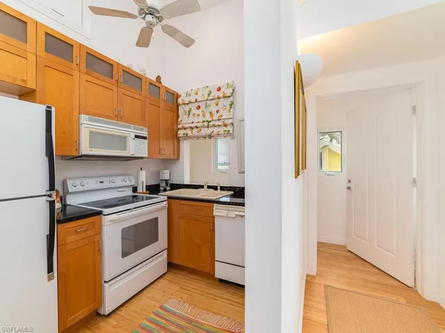 a kitchen with stainless steel appliances granite countertop a stove and a refrigerator