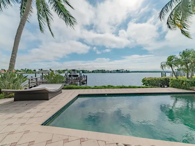 a view of a swimming pool with a patio