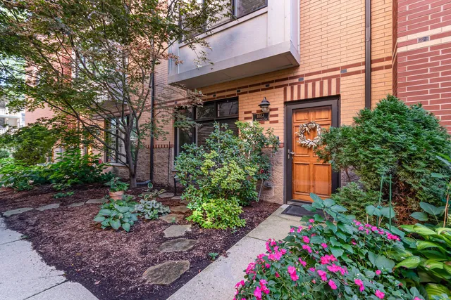 a flower plants in front of a house