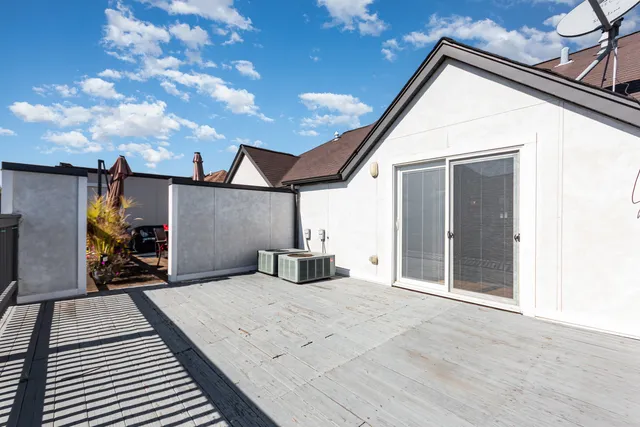 a view of a house with a barbeque