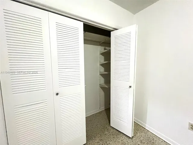 a view of a hallway with stairs