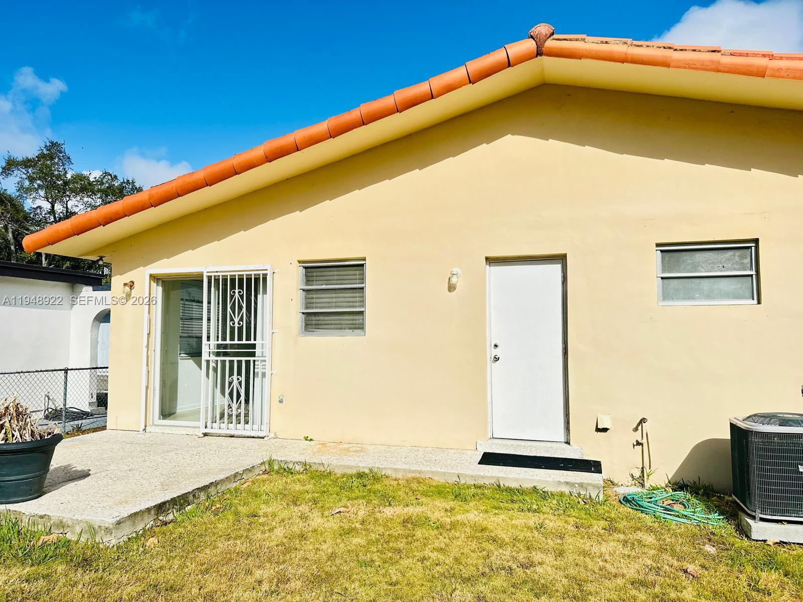 2762 Southwest 21st Street Miami, FL 33145 - Photo 2 of 14 a blue white house with a large pool