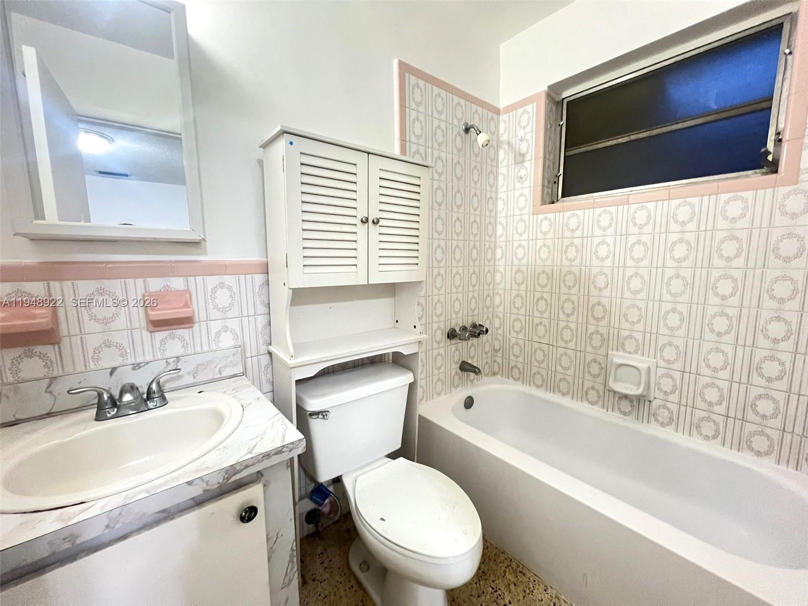 2762 Southwest 21st Street Miami, FL 33145 - Photo 9 of 14 a bathroom with a sink toilet a mirror and bathtub