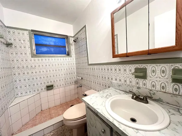 a bathroom with a sink and a toilet