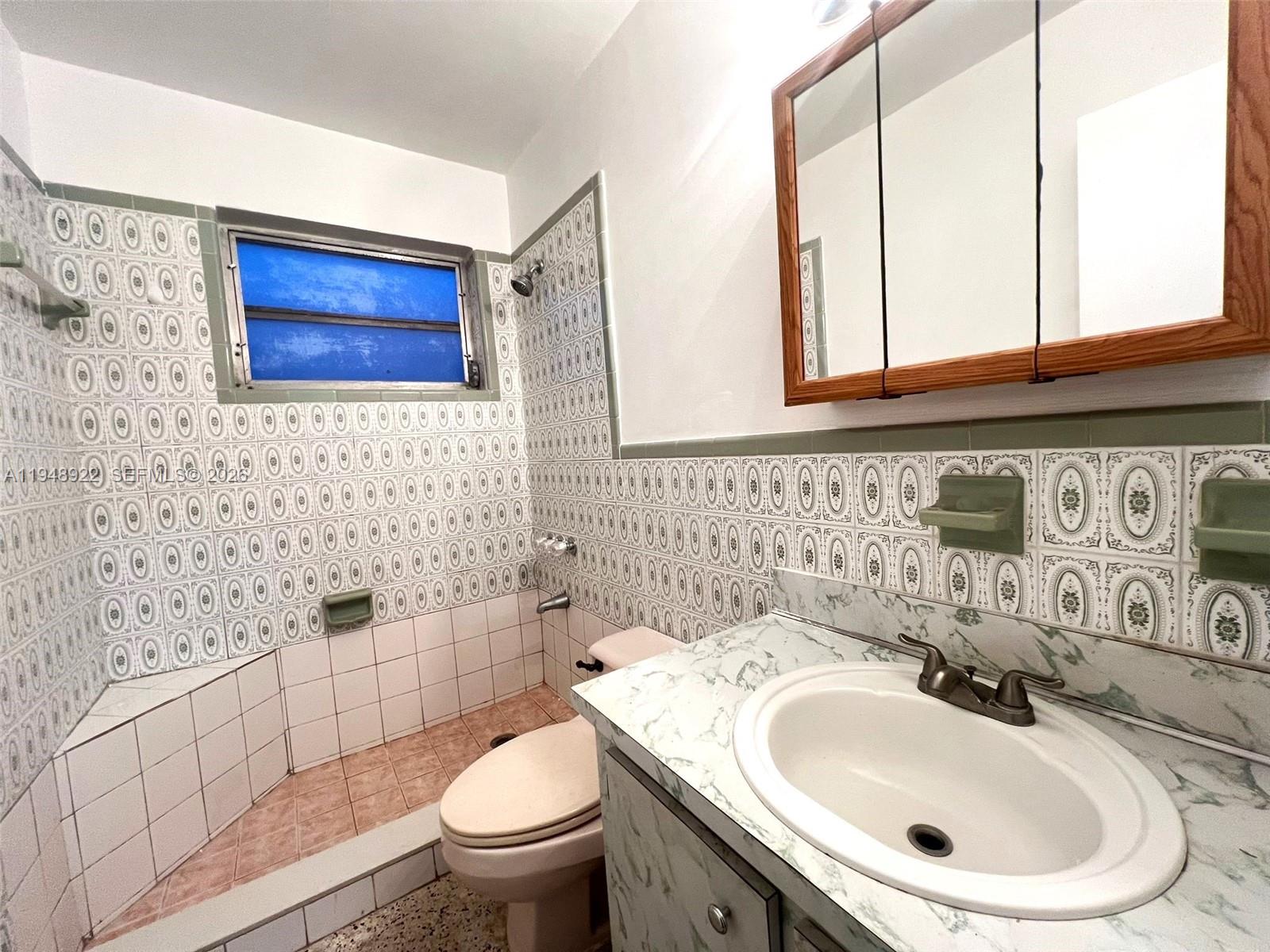 2762 Southwest 21st Street Miami, FL 33145 - Photo 10 of 14 a bathroom with a sink and a toilet